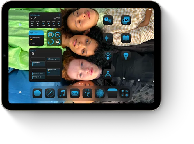 iPad mini showing apps and widgets coordinating with customized wallpaper on the home screen.