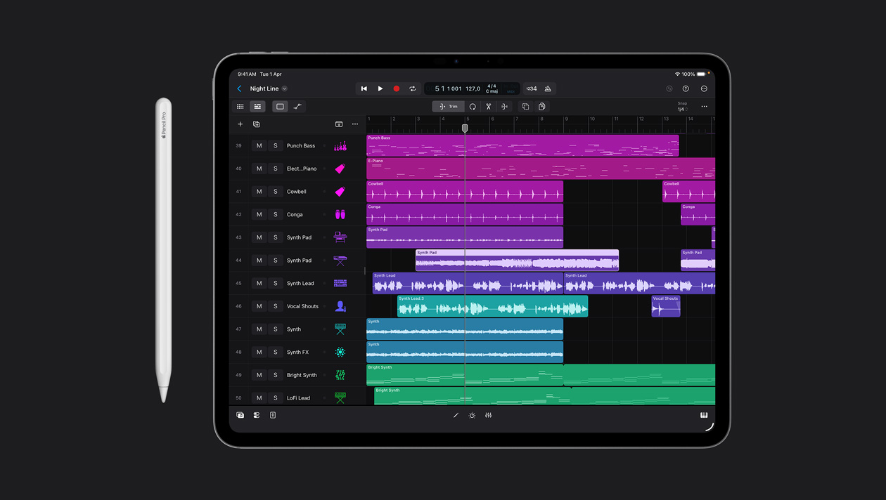 iPad Pro 13 screen showing Logic Pro workspace, list of different instruments on the left panel and their sound waves in different colours on the right, Apple Pencil to the left of device