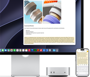 Mac mini front, tucked under Studio Display, an iPhone sits to the right of the device and the display, text selected with cut, copy, paste, and AutoFill commands above on iPhone matches highlighted text on display, showcasing Universal Clipboard