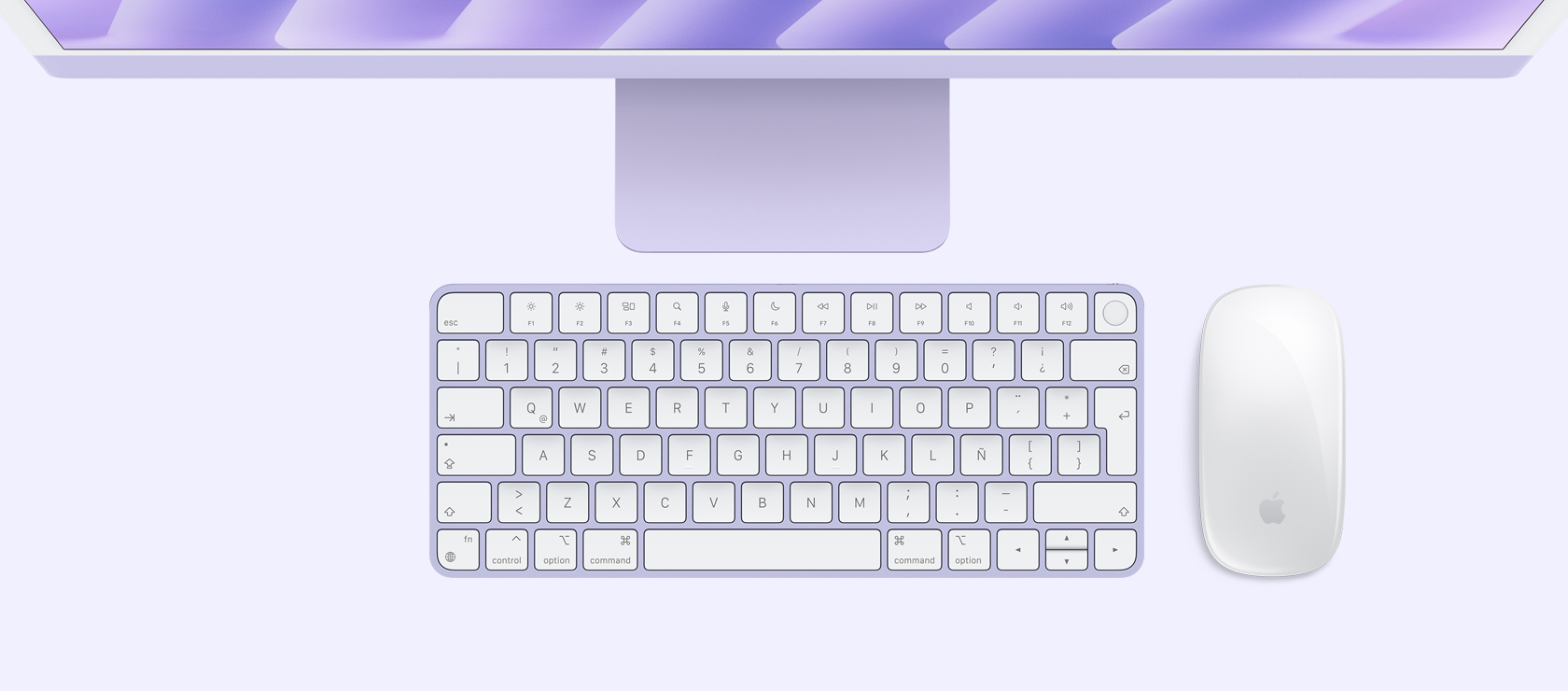 Vista panorámica de una iMac morada con mouse y teclado a juego