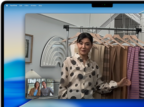 A video call on a MacBook Pro where a woman shows fabrics to two people on the call, with Center Stage keeping her centered in the frame as she moves around