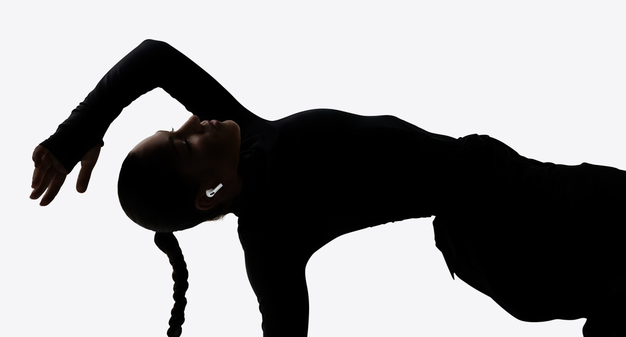 AirPods Pro 3 inserted in the ear of a dancer as they enjoy a hands-free listening experience