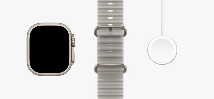 ساعة Apple Watch Ultra 4، إطار بلون تيتانيوم طبيعي، شاشة تغطي الواجهة بالكامل، حزام المحيط بلون رمادي شبه شفاف، كابل شاحن Apple Watch المغناطيسي السريع إلى ‏USB‑C‏