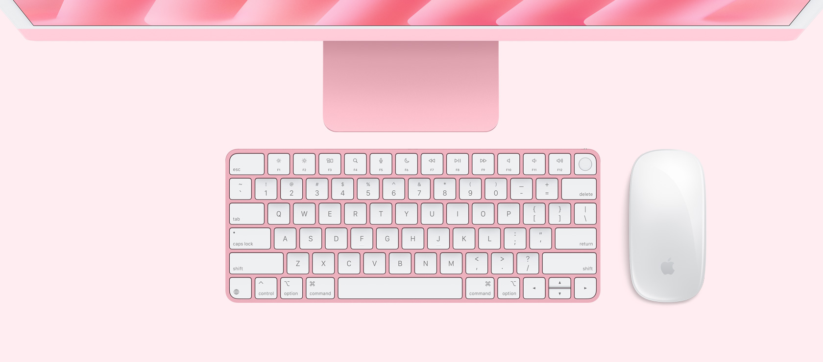 Rausvos spalvos „iMac“ vaizdas iš viršaus su spalvą atitinkančia pele ir klaviatūra